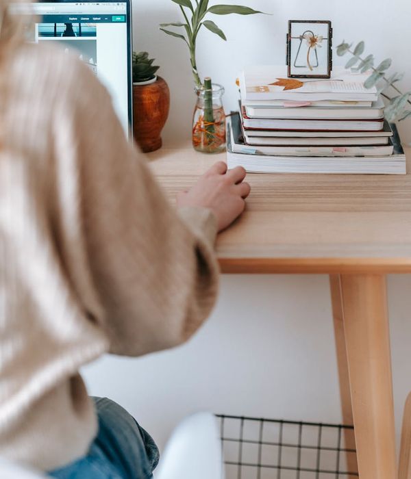 Cozy home office with natural light organized desk and comfortable workspace