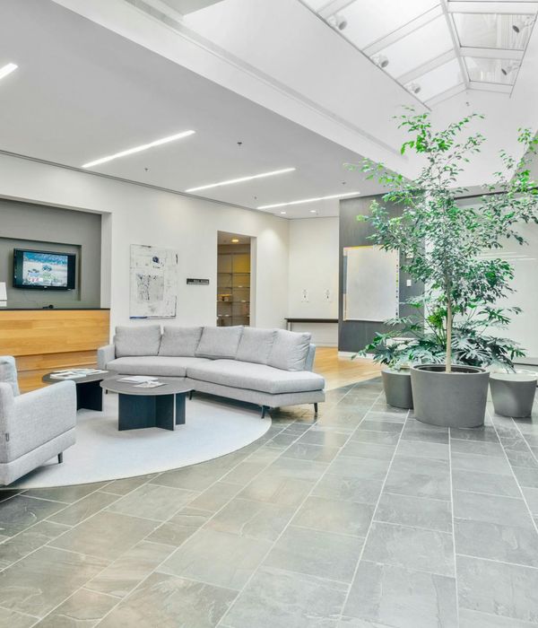 Modern office reception area with comfortable seating and welcoming atmosphere
