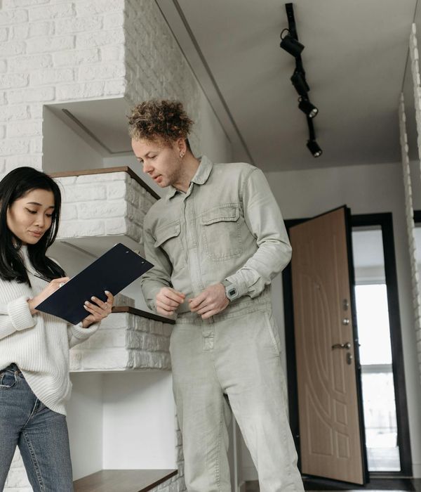 Professional consultation between interior designer and client discussing project details